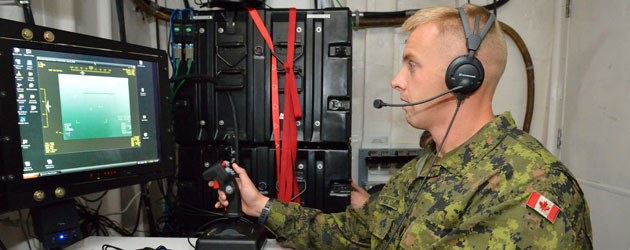 Corporal Kendall Hartjes operates an Unmanned Aerial Vehicle