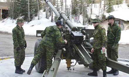 Soldiers deep in avalanche country keeping roadways clear