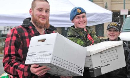 Base volunteers shred for veterans’ care