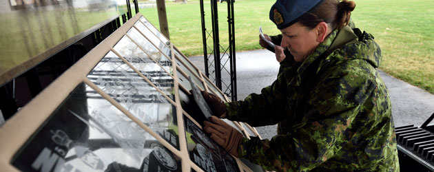 Placing plaque of a fallen Canadian Soldier
