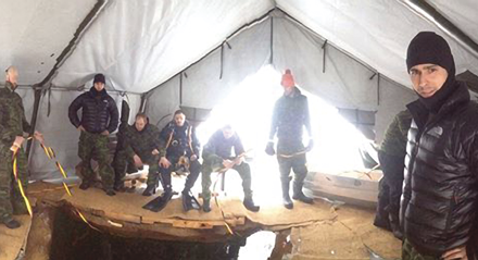 Dive unit explores depths of a frozen lake for training