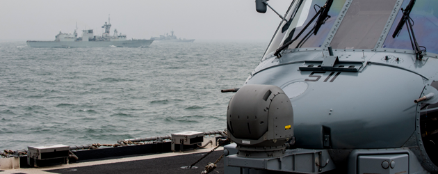 Sailing past the USS VICKSBURG