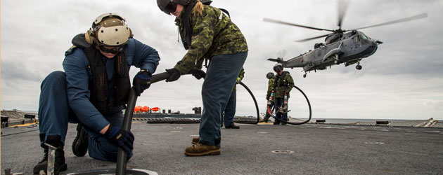 HMCS Fredericton refuels Sea King