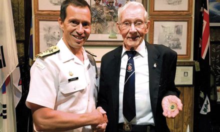 Navy replaces veteran’s stolen coin