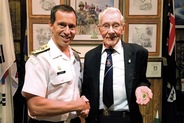 Navy replaces veteran’s stolen coin