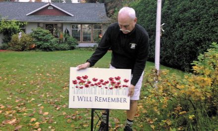 Signage promotes Remembrance Day and HMCS Alberni Museum in Comox