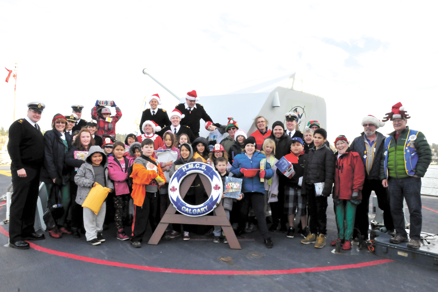 Santa surprises children onboard warship