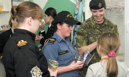 Female sailors visit Romanian charity