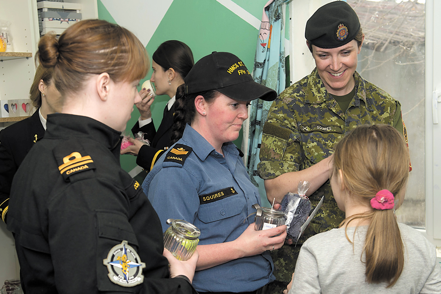 Female sailors visit Romanian charity