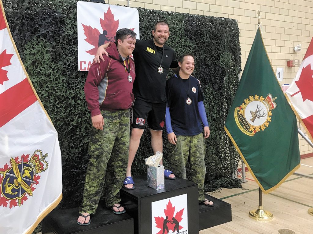 MS Thibault receives his gold medal at the CAF Combatives Grappling Tournament.