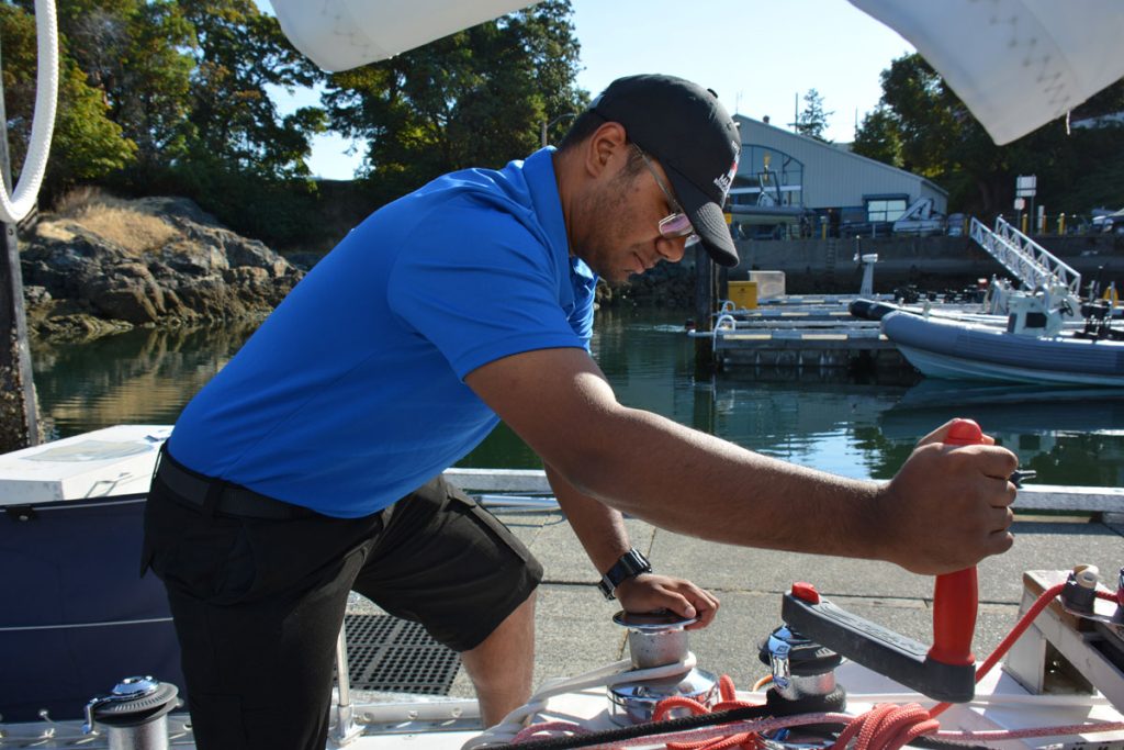 NCdt Marc Mahadeo takes his turn cranking the winch on board STV Goldcrest.
