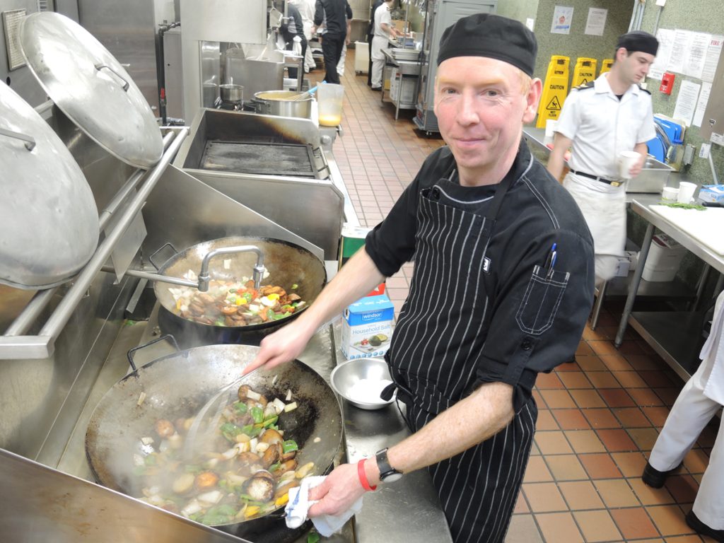 LS Robbie McDougall of Base Foods showcases his special cod fillet meal in the kitchen at Nelles Block. Photo by Peter Mallett
