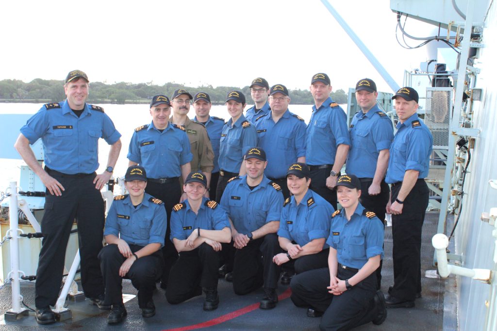 Commodore Topshee and his staff pose as OTTAWA enters Pearl Harbor.
