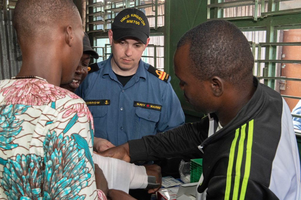 Lt(N) Greg Morrow supervises while local teachers practice first aid at Foyer Don Bosco school in Cotonou