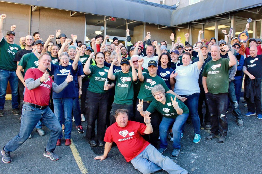 HeroWork volunteers gather for a group photograph after completing a Radical Renovation at the Mustard Seed Food Bank in October 2018. Photo by Terri Kott