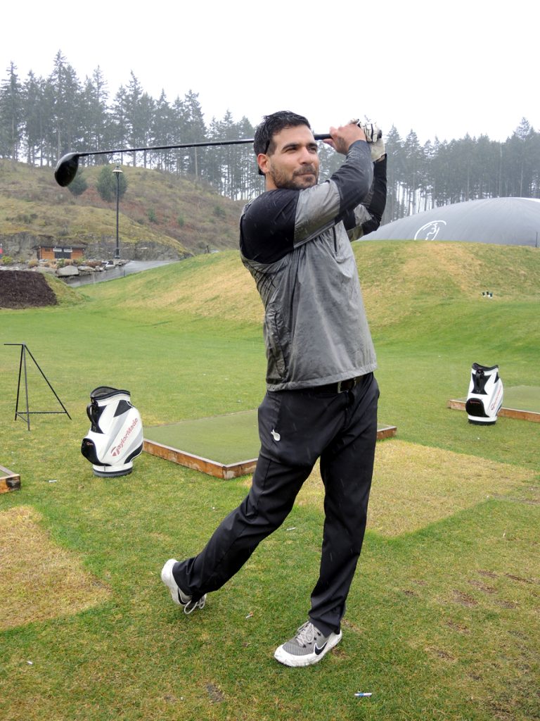 Private (Retired) Tanner Wilson gets some practice in on the driving range at Bear Mountain Golf Club during a Soldier On Golf Camp