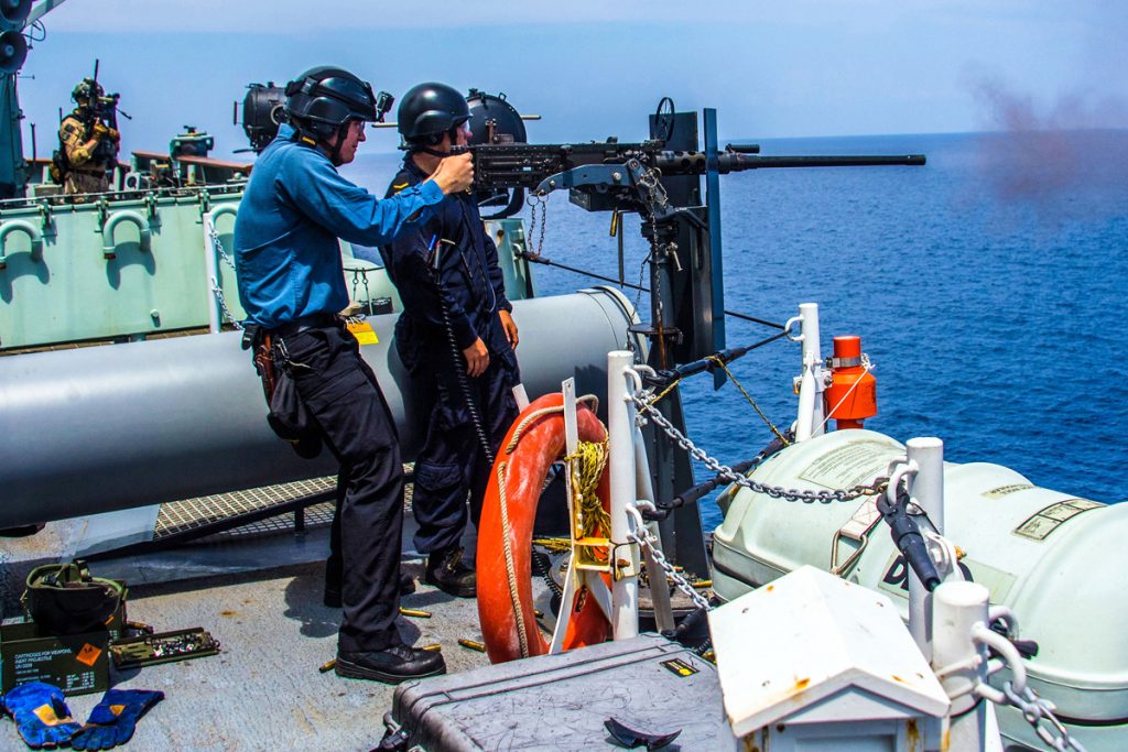 Able Seaman Samuel Gagnon (right) and Ordinary Seaman Zachary Bacon conduct a live-fire training exercise. Photo by Corporal Stuart Evans