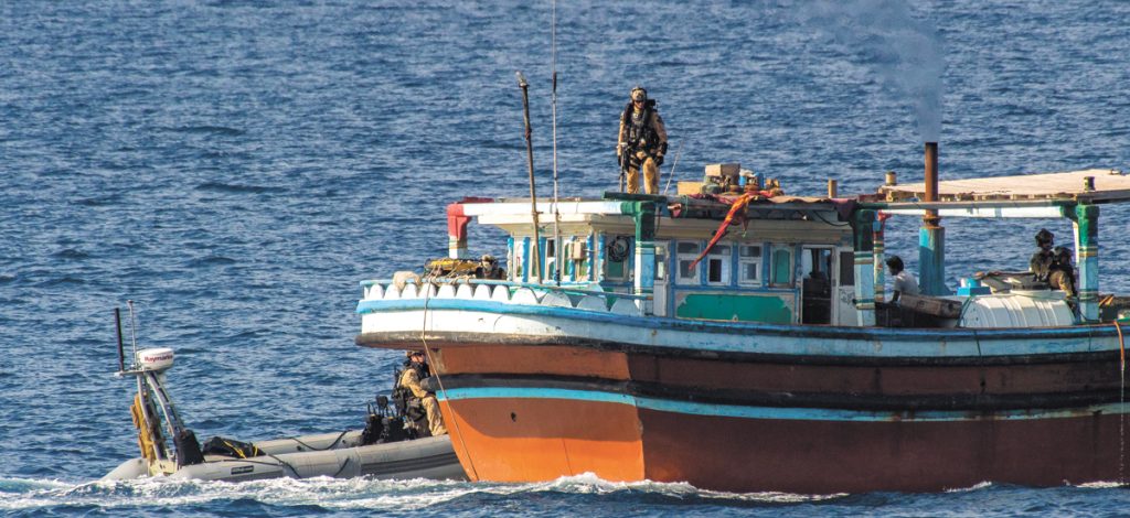 HMCS Regina’s Naval Tactical Operations Group boards a dhow during Operation Artemis.