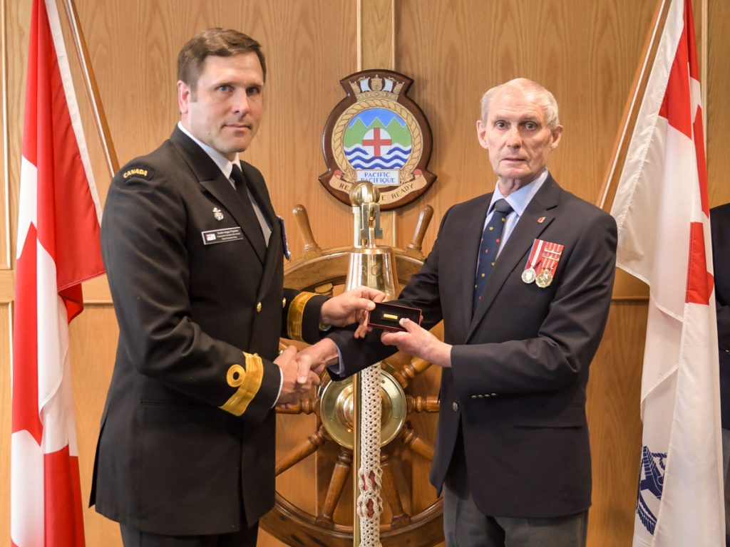 Cmdre Angus Topshee presents Cdr (Retired) Al Kennedy with athe Wound Stripe on May 14. Kennedy was severely injured in the HMCS Kootenay explosion on Oct. 23