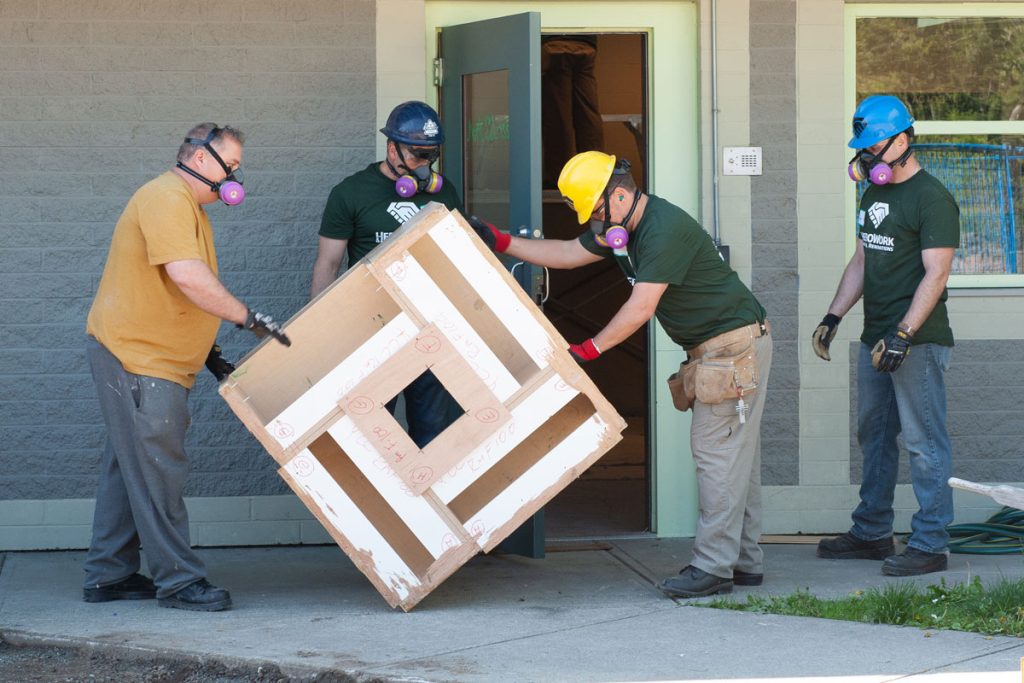 Military members remove a table from the former detention centre. Photo by John Penner/ John’s Photography