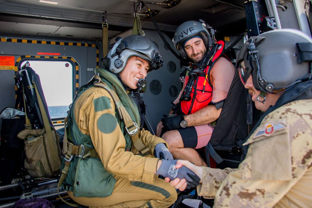 Members of the French Navy NH90 helicopter detachment from Task Force 473 meet with members of HMCS Regina’s Cyclone helicopter detachment on the ship’s flight deck. Photo by Cpl Stuart Evans