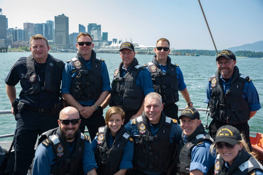 Members of the Vancouver Police Department’s Marine Unit pose for a group photo with the crew of HMCS Vancouver. Photo by LS Brendan Gibson