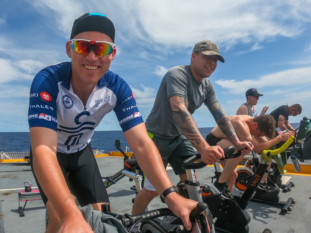 Commander Jacob French (left) conducts the Navy Shadow Bike-A-Thon. Photo by Leading Seaman Stuart Carmichael