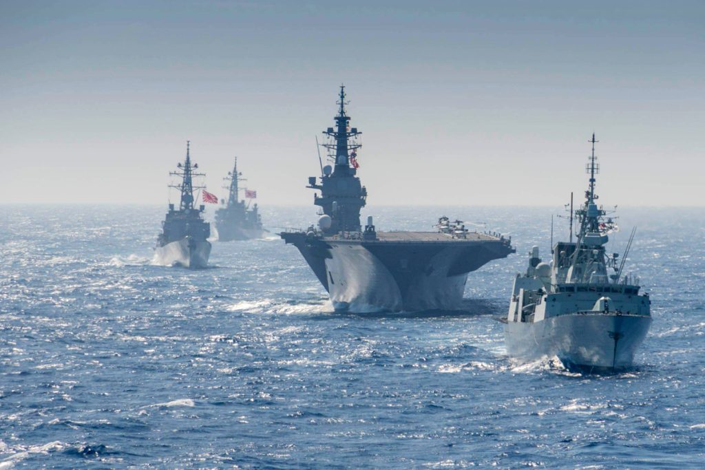 HMCS Regina conducts manoeuvres with NRU Asterix and the Japenese military during Operation PROJECTION on June 13th. Photo by Japanese Image Technician. Edited by Corporal Stuart Evans