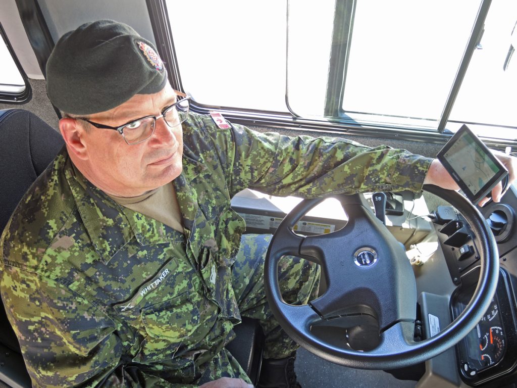 WO Terence Whittaker of Base Logistics shows off a Garmin Display used in the Trakopolis digital tracking system. Trakopolis is currently used by 13 vehicles at the base’s Transport Electrical and Mechanical Engineering (TEME) unit.  Photo by Peter Mallett