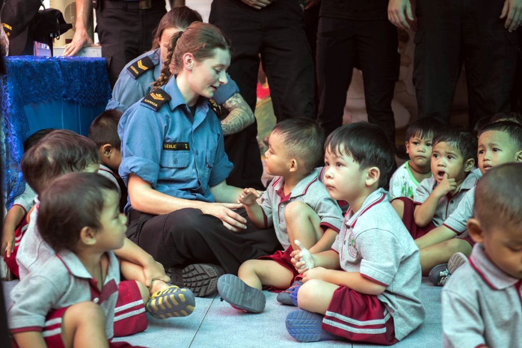Master Seaman Veronica Leslie interacts with a preschool class during a trip to the Father Ray Foundation. Photo by Leading Seaman Victoria Ioganov