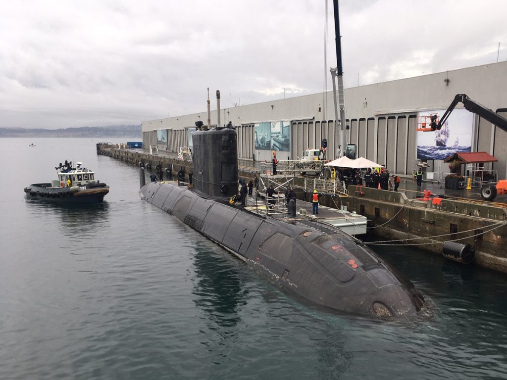 Jetty Services staff from Port Operations and Emergency Branch work to secure Victoria-Class submarine HMCS Chicoutimi before Defence on the Dock at Ogden Point on Sept. 15.  Photo by POESB