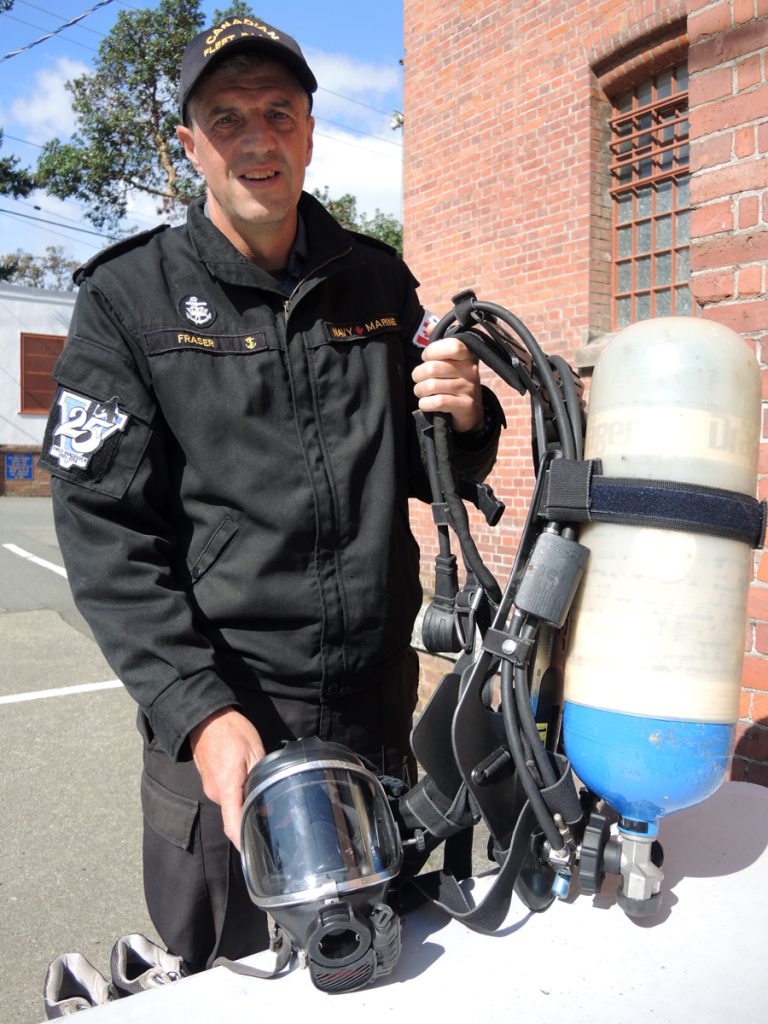 CPO2 Chris Fraser displays the flash gear he will run in during the upcoming Goodlife Fitness Victoria Marathon. His run is a fundraiser for the Esquimalt Military Family Resource Centre. The gear weighs approximately 25 lbs and CPO2 Fraser hopes to set a Guiness Book of World Records marker with the feat.  Photo by Peter Mallett