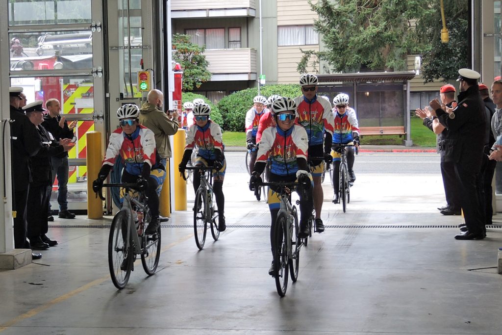 Tour de Rock riders make their way into CFB Esquimalt Fire and Rescue during a tour stop on at CFB Esquimalt Fire and Rescue hall. Photo by Peter Mallett