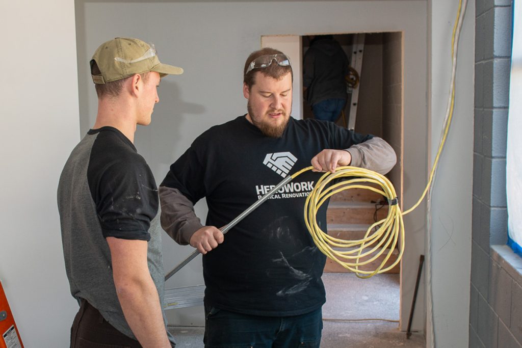 Volunteers from the base and across Victoria pitched in on the latest Radical Renovation on behalf of local charity HeroWork at Peers Victoria Resource Society. Photo by John W.Penner
