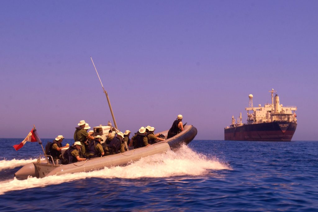 Members of HMCS Regina’s naval boarding party make their way in a Rigid Hull Inflatable Boat (RHIB)