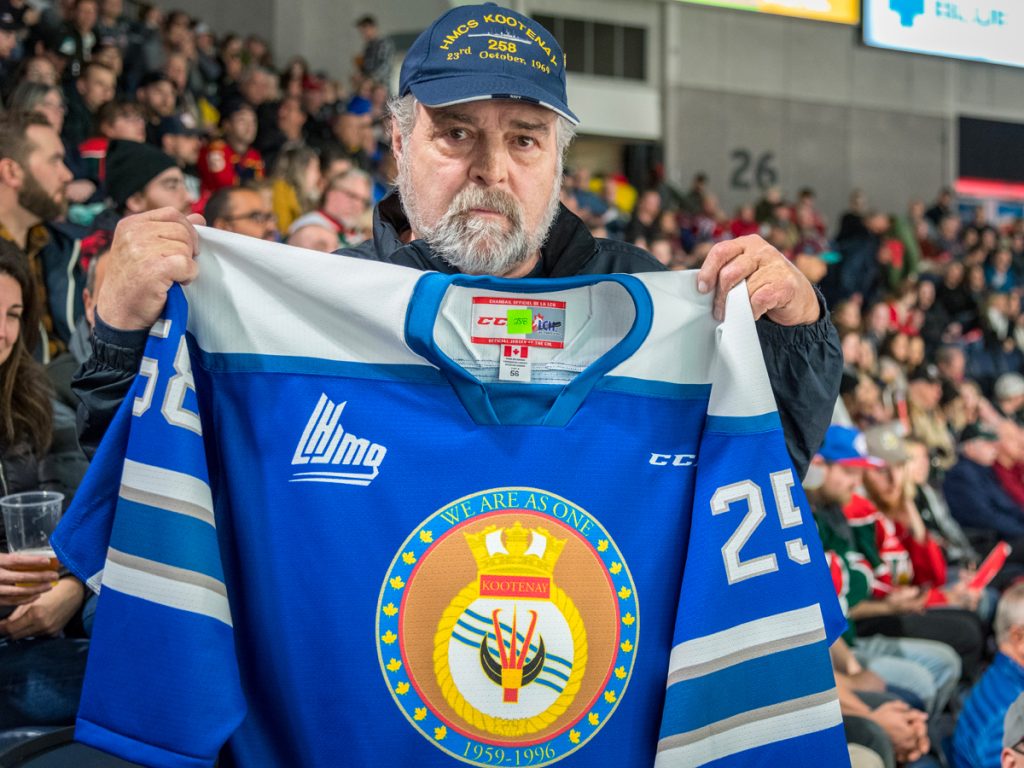 LS (Retired) Allan “Dinger” Bell shows off this year’s special Mooseheads jersey design honouring HMCS Kootenay. Photo by Cpl David Veldman