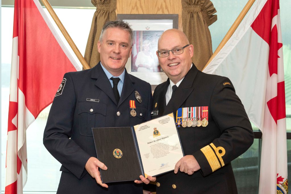 Robert Minnick receives a Commander Royal Canadian Navy Commendation presented by Commander Maritime Forces Pacific Rear-Admiral Bob Auchterlonie. The citation reads: On 28 November 2018