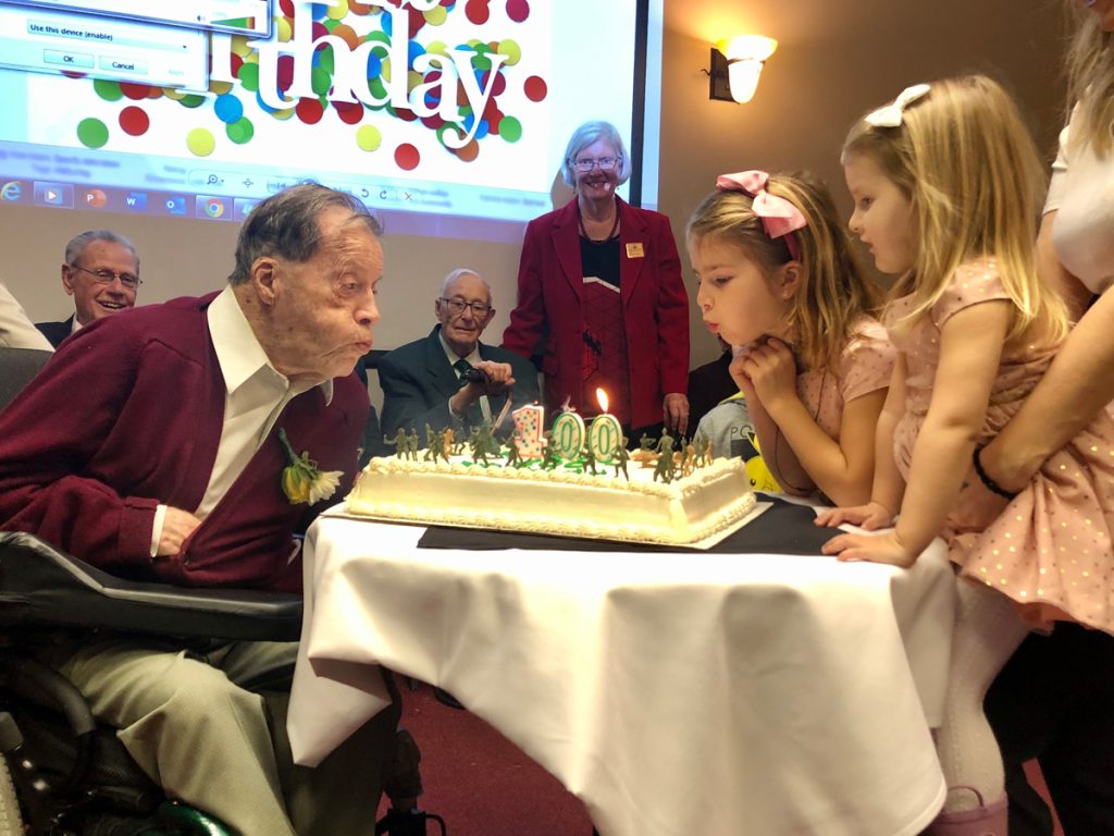 Major (Ret’d) Murray Edwards blows out the candles on his birthday cake. Edwards