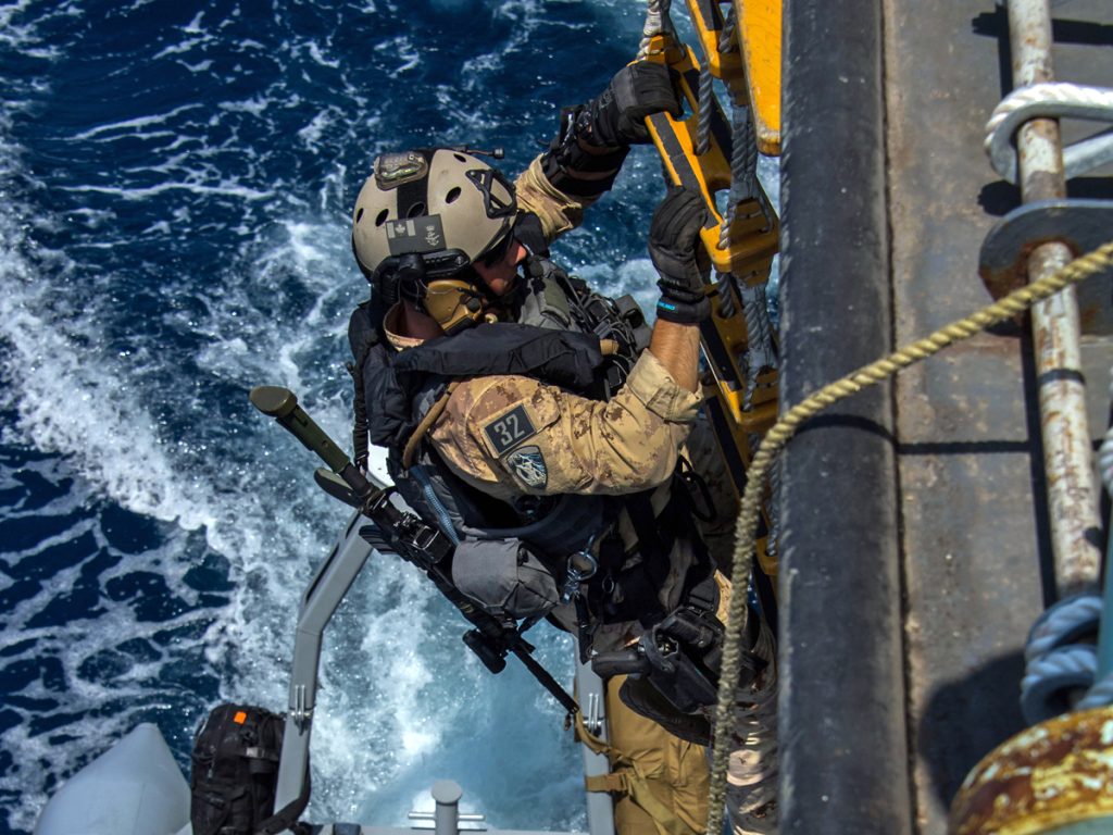 HMCS Regina’s Naval Tactical Operations Group prepares to board a Dhow during Operation Artemis in the Pacific Ocean on April 18. Photo by Corporal Stuart Evans