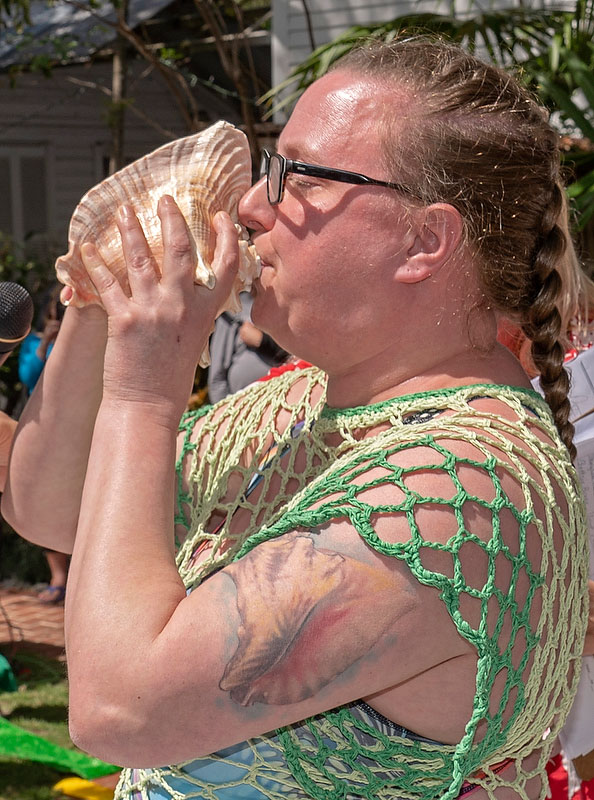 PO2 Alliszon Zaichkowski toots her conch shell during the annual Key West Conch Shell Blowing Contest Saturday