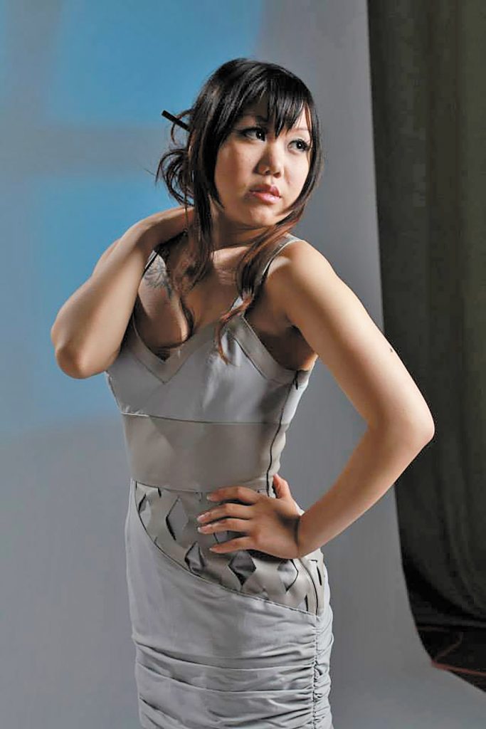 A grey dress by AB Li made for her graduation fashion show. It’s a mixture of cotton and leather