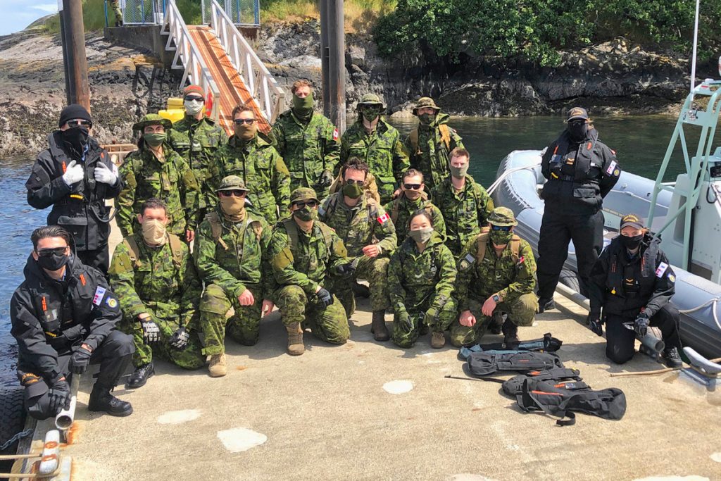 Mission Complete: Army and Navy Reservists line the jetty at Albert Head following the at-sea move from HMCS Malahat in downtown Victoria to the training area during Exercise Strong Mariner May 22.  Photo by Capt Jeff Manney