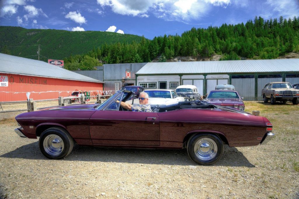 Former Navy Lieutenant Rex Landis behind the wheel of a 1968 Pontiac Beaumont convertible