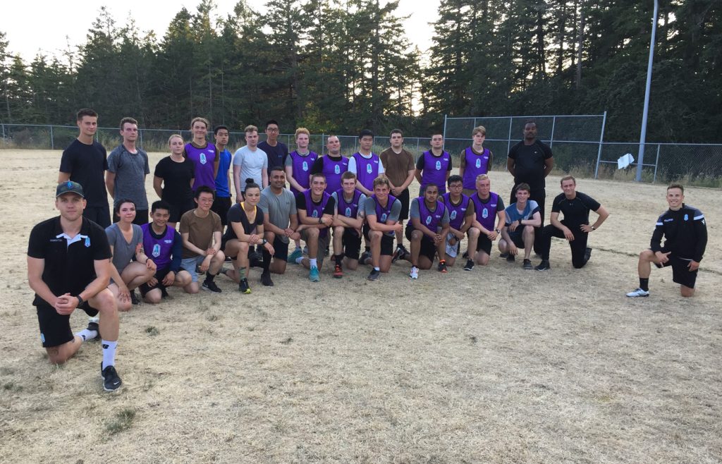 Members of Pacific Football Club gather for a group photo with reservists from 39 Brigade Group following a training session at Albert Head Cadet Training Centre on July 30. Photo by Drew Shaw