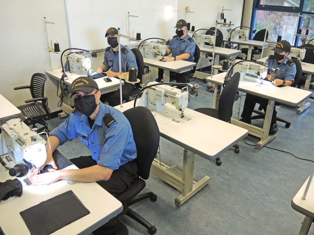 Members of Naval Fleet School Pacific gather for a group photograph in celebration of their 11