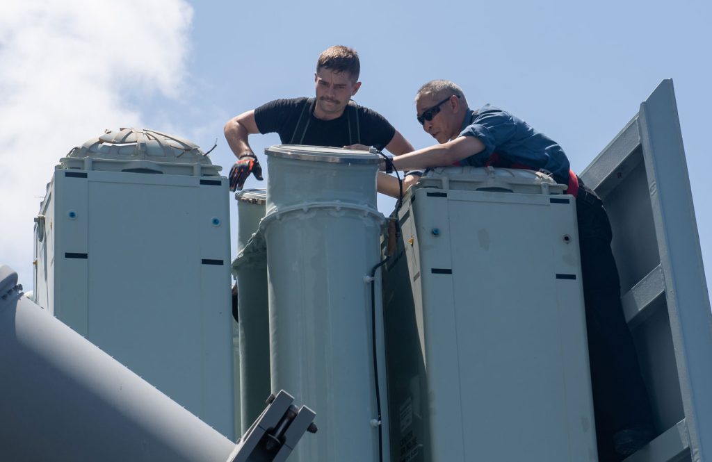 Members of HMCS Winnipeg conduct post-firing maintenance on the Evolved Sea Sparrow Missile (ESSM) launcher off the coast of the Hawaiian Islands. Photos by Leading Seaman Valerie LeClair