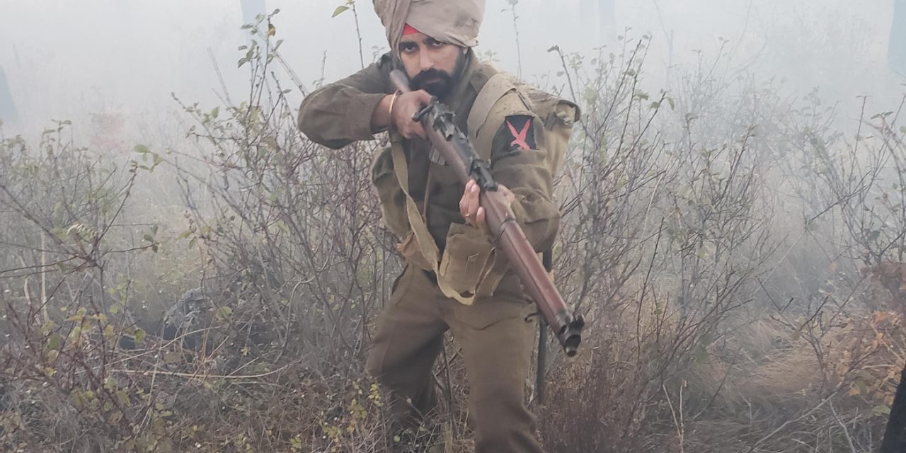 Sailor serves as an extra on Promises