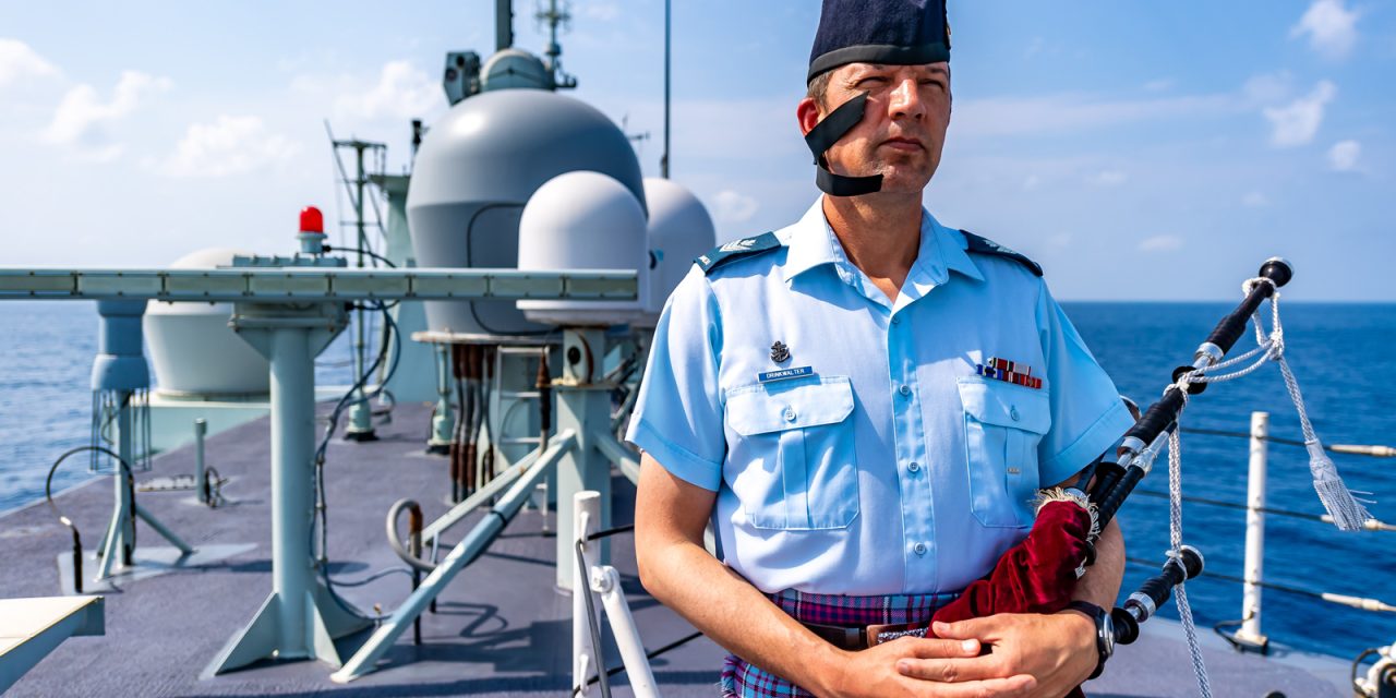 HMCS Calgary’s unofficial bagpiper
