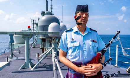 HMCS Calgary’s unofficial bagpiper