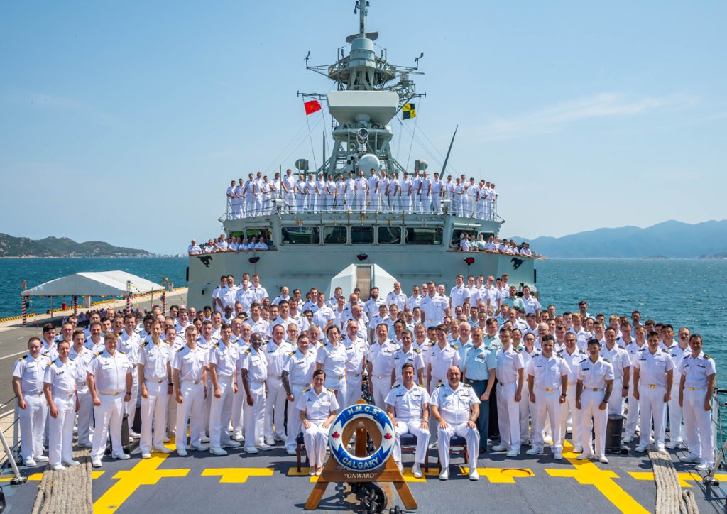 The ship’s company stand for a group photo in Cam Ranh Bay